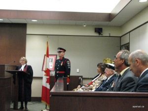 The citizenship judge, the RCMP officer, and the dignitaries